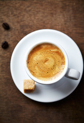 Cup of coffee on rustic background. Top view. 