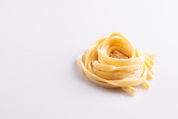 Home made pasta on white background, soft light, copy space