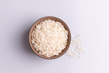 Italian Risotto rice on white background. Copy Space. Soft light. Latin term 