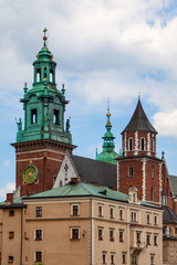 Fototapeta na wymiar Wawel Castle in Krakow (Poland) against the blue sky with white clouds