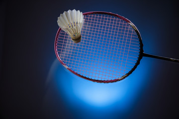 Badminton racket and shuttlecock  in motion closeup