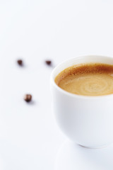 Cup of coffee on white background.  Copy space.