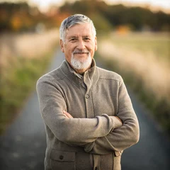 Portrait of handsome senior man in the autumn outdoors. Active senioor enjoying his retirement in the  nature © lightpoet