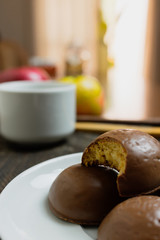 Honey bread cookie, typical Brazilian candy with cup of coffee on wooden background