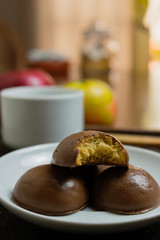 Honey bread cookie, typical Brazilian candy with cup of coffee on wooden background
