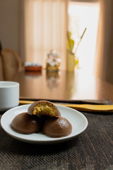 Honey bread cookie, typical Brazilian candy with cup of coffee on wooden background