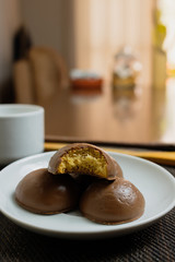 Honey bread cookie, typical Brazilian candy with cup of coffee on wooden background