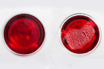 Glass of red wine with shadow.Top view. Abstract red wine bubbles.