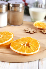 Christmas background with dry oranges and spices.