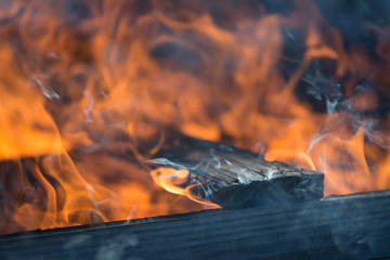 Wood pallet on fire burning flame .