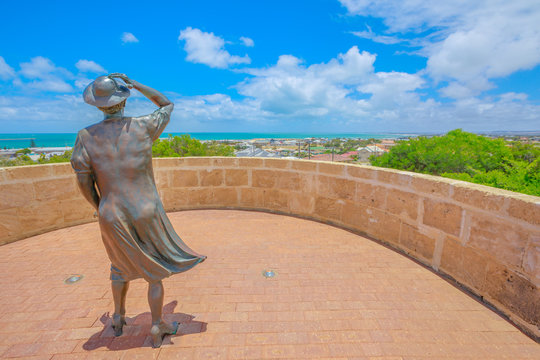 Geraldton, Australia - Dec 18, 2017: the Waiting Woman statue at HMAS Sydney II Memorial in Geraldton, atop Mount Scott overlooking the port of the city in Western Australia. Sunny day with blue sky.