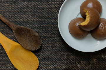 Honey bread cookie, typical Brazilian candy with cup of coffee on wooden background