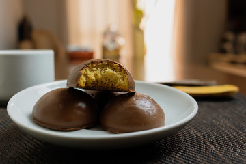 Honey bread cookie, typical Brazilian candy with cup of coffee on wooden background