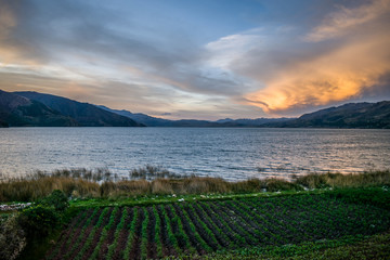  lagoon near mountains at sunset