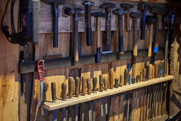 Old tools - hammers and files of different sizes.