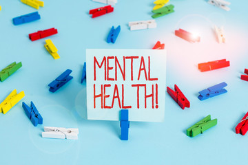 Writing note showing Mental Health. Business concept for demonstratings condition regard to their psychological well being Colored clothespin papers empty reminder blue floor officepin