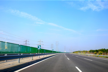 Fototapeta premium Beautiful highway, under the blue sky and white clouds