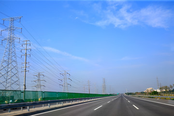 Beautiful highway, under the blue sky and white clouds