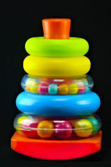 colorful pyramid for children on a black background