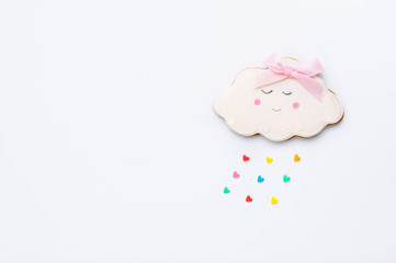 Cloud shape gingerbread cookie with heart rain on white background