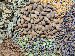 Fototapeta premium A mix of organic nuts and seeds - healthy diet - home cooking - vegan and vegetarian