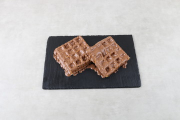 waffle with chocolate and pistachio an lotus biscuit and nutella