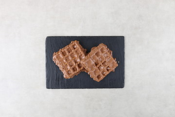 waffle with chocolate and pistachio an lotus biscuit and nutella