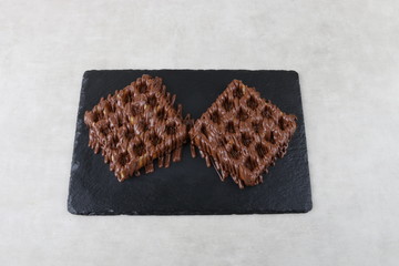 waffle with chocolate and pistachio an lotus biscuit and nutella