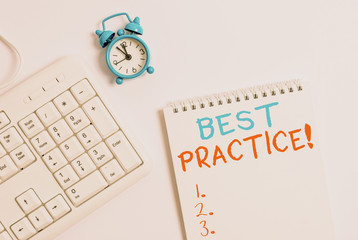 Writing note showing Best Practice. Business concept for commercial procedures that are accepted prescribed being correct Keyboard with empty note paper and pencil white background