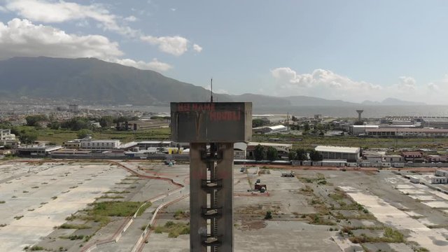 Abandoned tower, stairwell with mount Vesuvius in the background, Volcano and apocalypse, Aerial footage