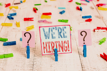 Writing note showing We Re Hiring. Business concept for recently employ someone or pay someone to...