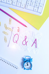 Handwriting text writing Q And A. Conceptual photo in which demonstrating asks questions and another one answers them Flat lay above white blank paper with copy space for text messages