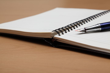 Business plan completed with pen and notebook 