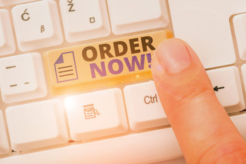 Writing note showing Order Now. Business concept for confirmed request by one party to another to...