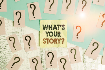 Text sign showing What S Your Story Question. Business photo text asking demonstrating about his past life actions events Scribbled and crumbling papers with thick cardboard above wooden table