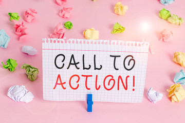 Writing note showing Call To Action. Business concept for exhortation do something in order achieve aim with problem Colored crumpled papers empty reminder pink floor background clothespin