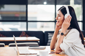 Lifestyle freelance working woman and laptop computer he listening music radio