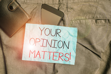 Text sign showing Your Opinion Matters. Business photo text show you do not agree with something that just been said Smartphone device inside trousers front pocket with wallet and note paper