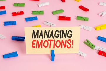 Conceptual hand writing showing Managing Emotions. Concept meaning ability be open to feelings and modulate them in oneself Colored clothespin papers empty reminder pink floor office