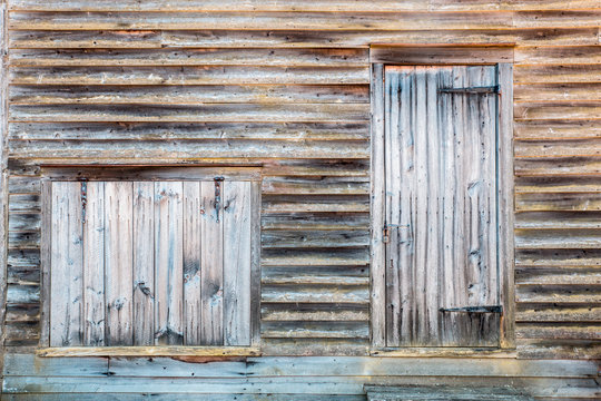 Old Wooden structure with boarded window and door