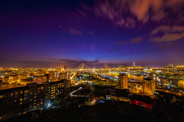 Panorama of the city of Vladivostok. Panoramic view of the Golden Horn and the central part of Vladivostok from one of the hills of the city at sunset time.