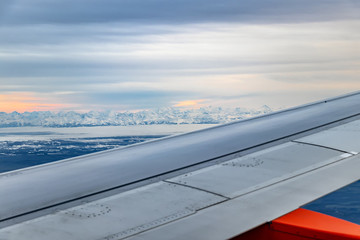 Fototapeta na wymiar View from airplane passenger window of Swiss Mountains