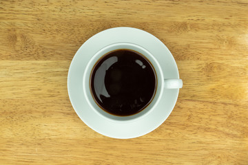 cup of coffee on table with beans