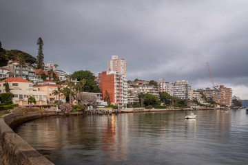 Fototapeta premium apartments over looking a bay with dawn clouds
