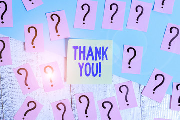 Conceptual hand writing showing Thank You. Concept meaning polite expression used when acknowledging gift service compliment Crumbling papers with thick cardboard on the wooden table