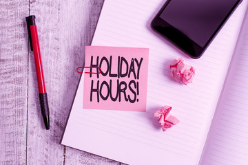 Text sign showing Holiday Hours. Business photo text Overtime work on for employees under flexible work schedules Thick pages notebook stationary placed above classic look wooden backdrop