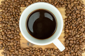 Hot coffee in a cup and coffee  beans
