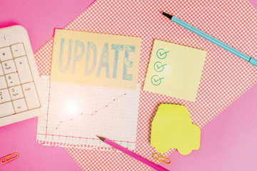 Handwriting text writing Update. Conceptual photo make something more modern or up to date like software program Writing equipments and computer stuffs placed above colored plain table