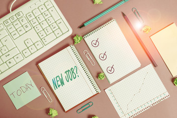 Fototapeta premium Writing note showing New Job Question. Business concept for formal meeting which someone asked find out if they are suitable Writing equipments and computer stuffs placed above colored plain table