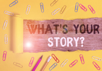 Handwriting text writing What S Your Story Question. Conceptual photo asking demonstrating about his past life actions events Stationary and torn cardboard placed above a wooden classic table backdrop